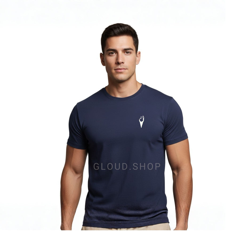 Man wearing a navy blue t-shirt with a small white logo on a white background